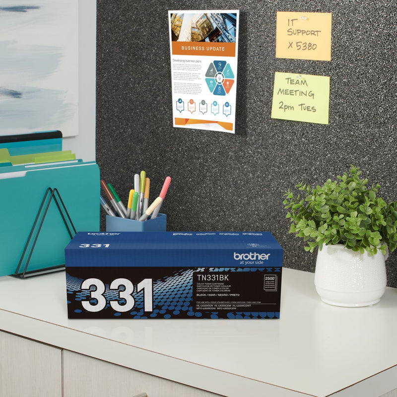 Brother toner cartridge in office setting with organizational supplies