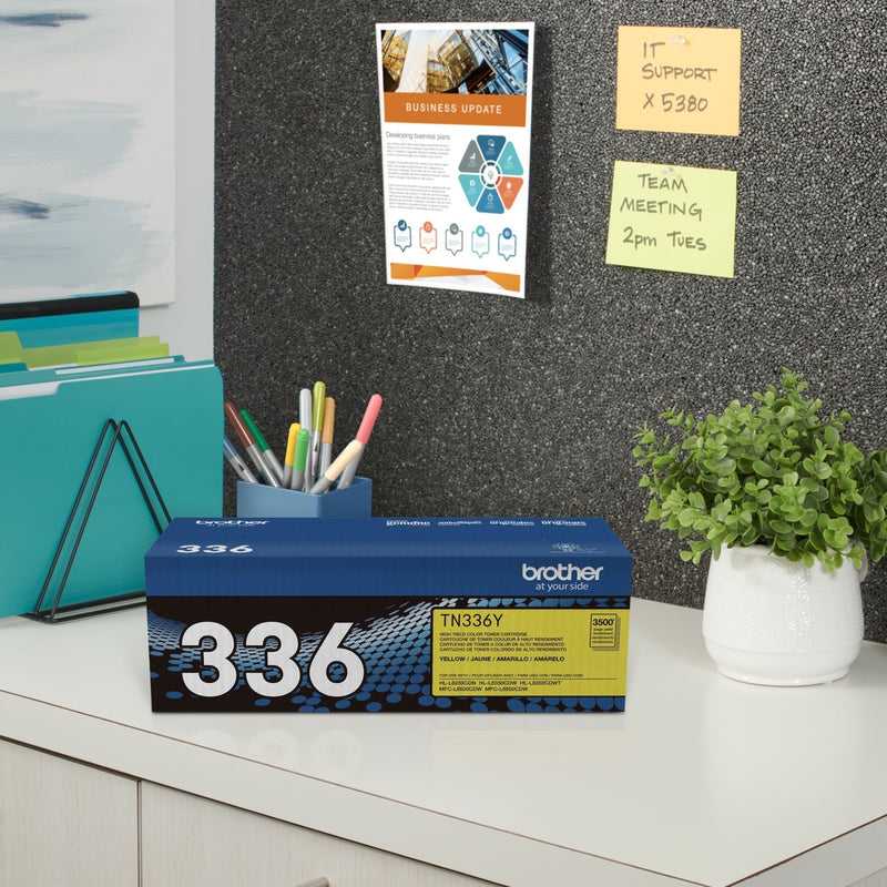 Brother TN336Y toner cartridge in office storage setting