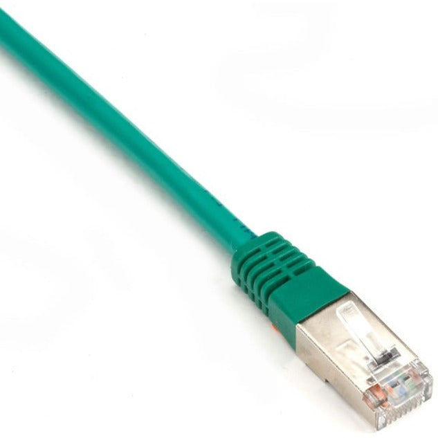 Close-up of green Cat.6 network cable showing RJ-45 connector with gold-plated contacts and strain relief boot