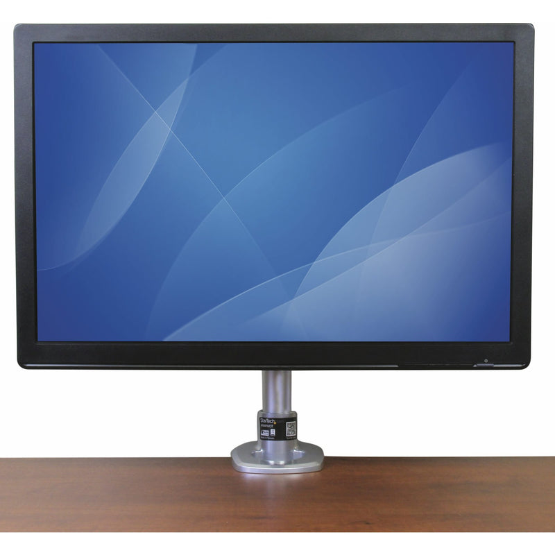 Front view of monitor mounted on StarTech.com ARMPIVOT stand showing clean installation on wooden desk