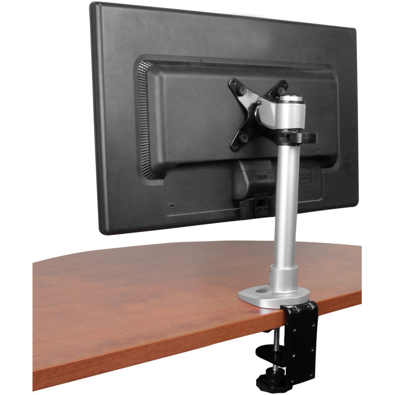 Monitor mount installed on wooden desk showing rear view of mounted display and clamp mechanism