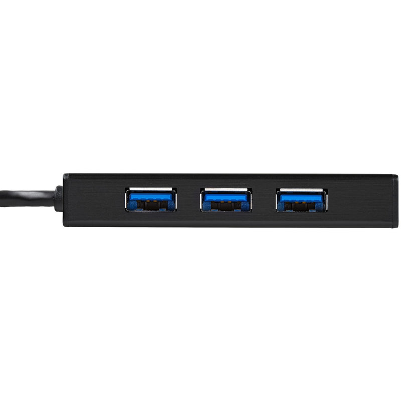 Close-up view of three USB 3.0 ports with blue connectors on StarTech.com hub