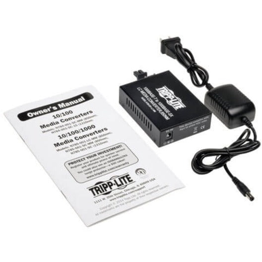 Complete product package with manual, power adapter, and media converter