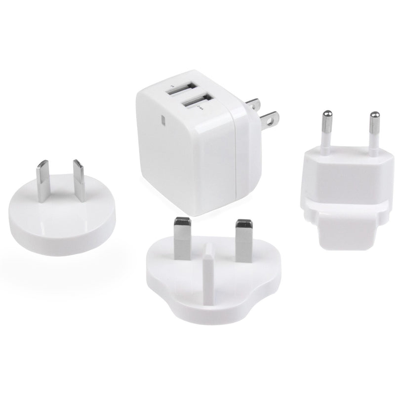 Collection of white international plug adapters with main charging unit