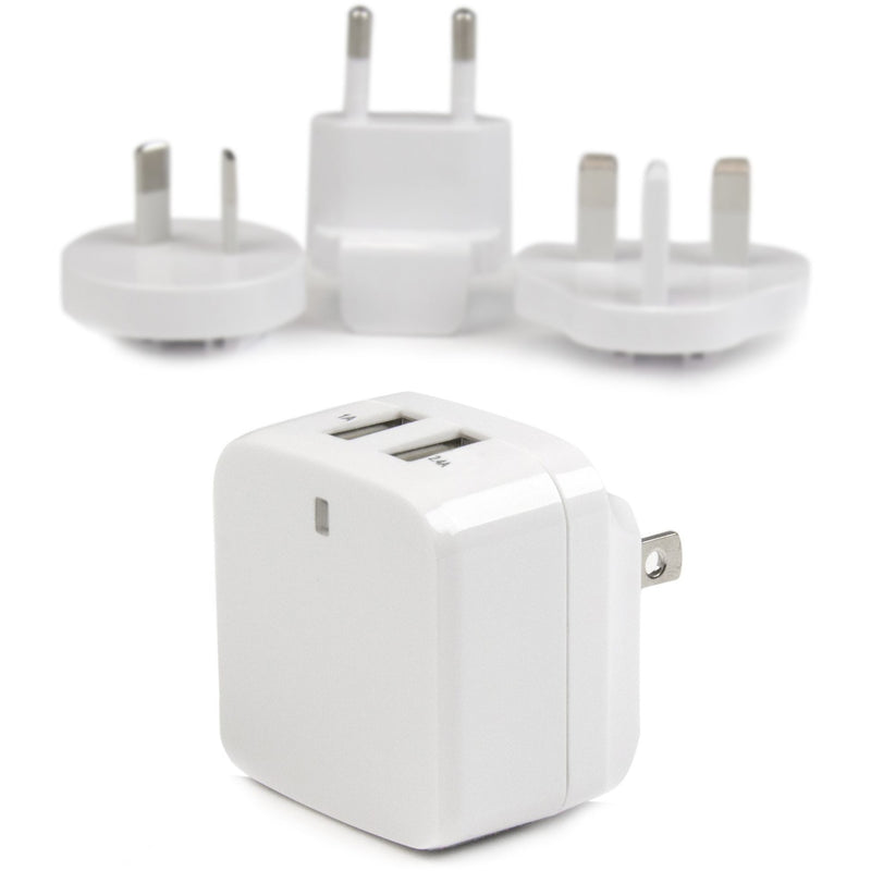 White dual USB wall charger with multiple international plug adapters shown in background