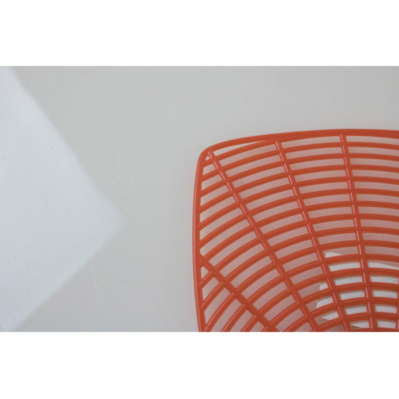 Extreme close-up of orange fly swatter grid pattern