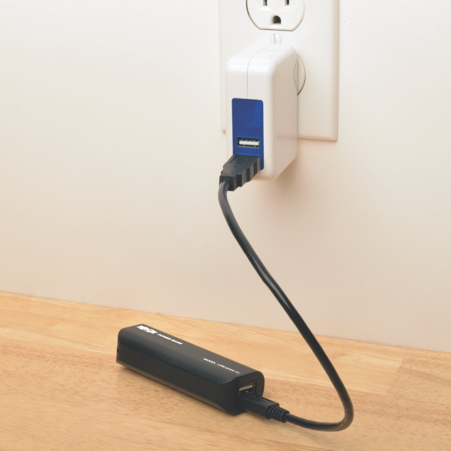 Tripp Lite power bank being charged through a wall outlet-alternate-image2