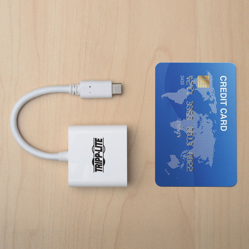 Size comparison of Tripp Lite adapter with credit card