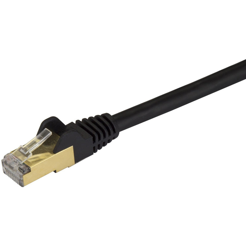 Detailed image of Cat6a cable's shielded RJ45 connector showing gold contacts and strain relief boot