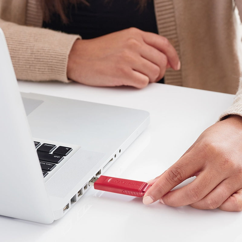 USB drive being inserted into laptop USB port