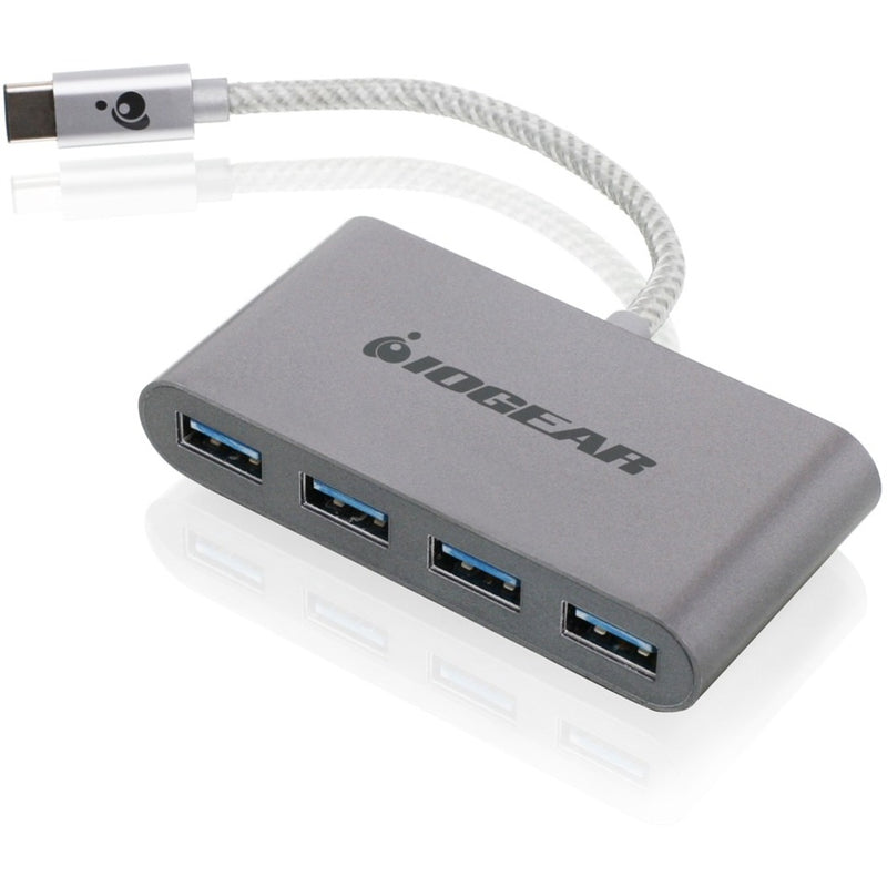 Angled view of IOGEAR USB-C hub showing all four USB 3.0 ports and aluminum construction