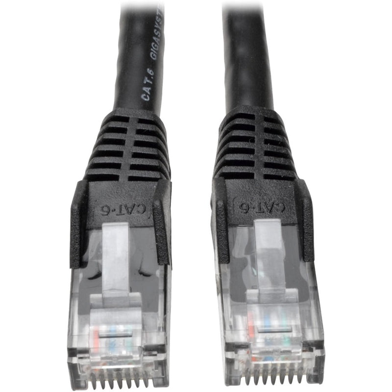 Close-up view of transparent RJ-45 connectors with gold contacts and black snagless boots on Tripp Lite Cat.6 network cable