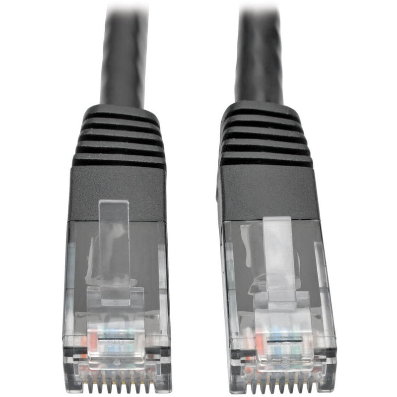 Close-up view of two transparent RJ45 connectors with gold-plated contacts and black strain relief boots on Tripp Lite Cat6 cable