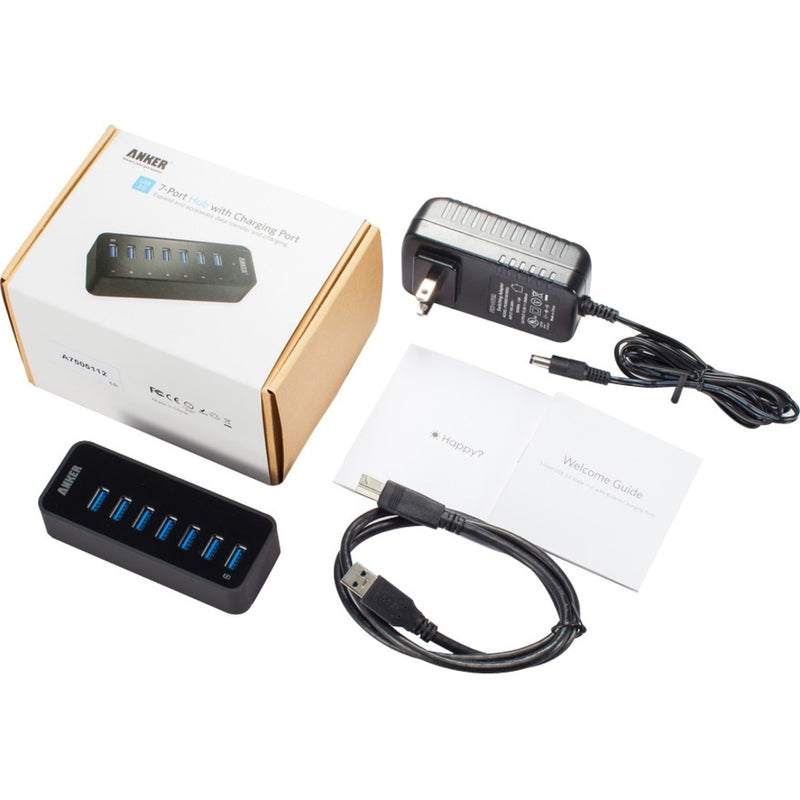 Complete package contents of Anker 7-port USB hub including power adapter and cables