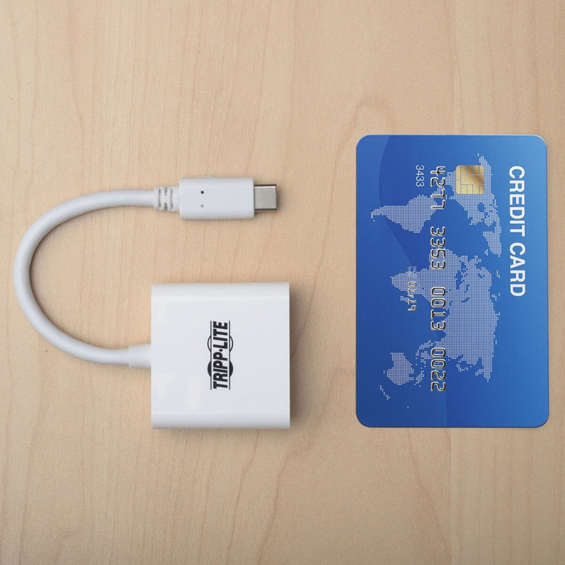 Tripp Lite adapter shown next to credit card for size comparison