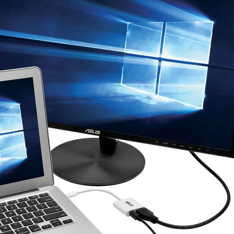 Laptop connected to 4K monitor via Tripp Lite adapter showing Windows desktop