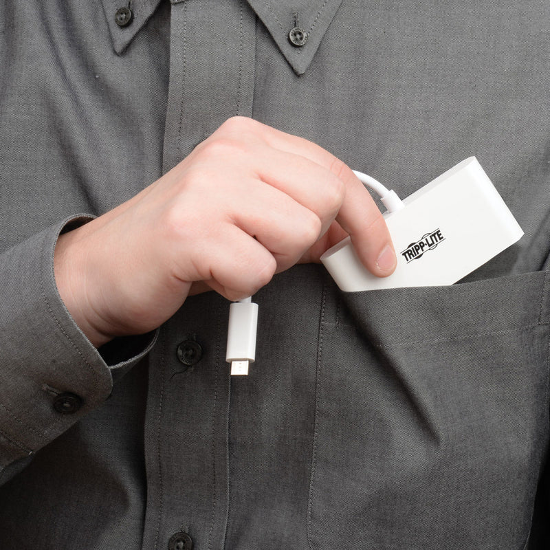 Person connecting the white Tripp Lite USB-C hub showing its reversible design