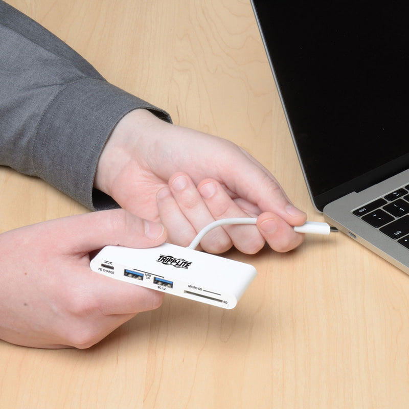 Person connecting USB-C hub to laptop showing ease of use