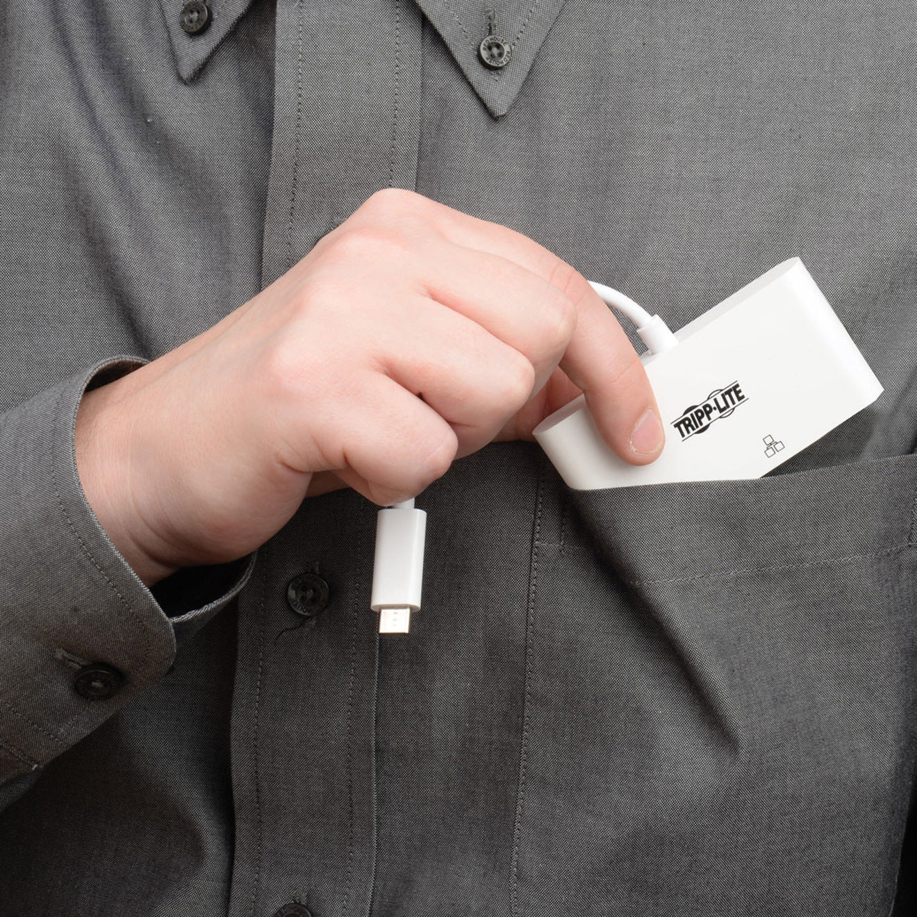 Close-up of hand holding and connecting Tripp Lite docking station-alternate-image6