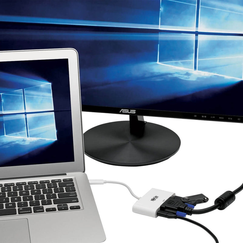 Laptop connected to external monitor using Tripp Lite adapter showing Windows desktop