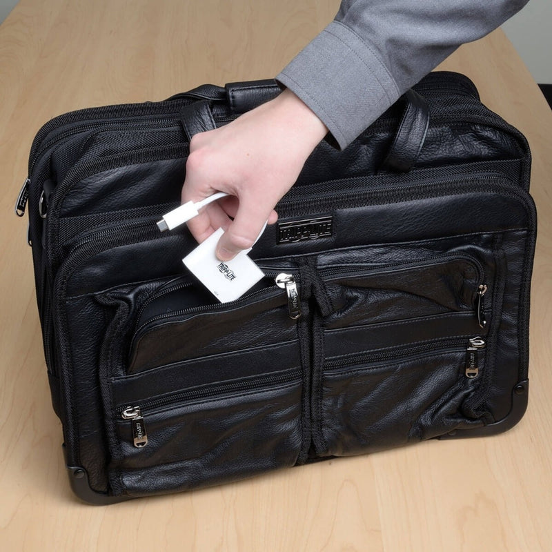 Adapter being placed in leather business bag