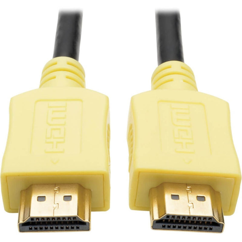 Close-up view of yellow HDMI connectors with gold-plated contacts and Tripp Lite branding on the P568-006-YW cable