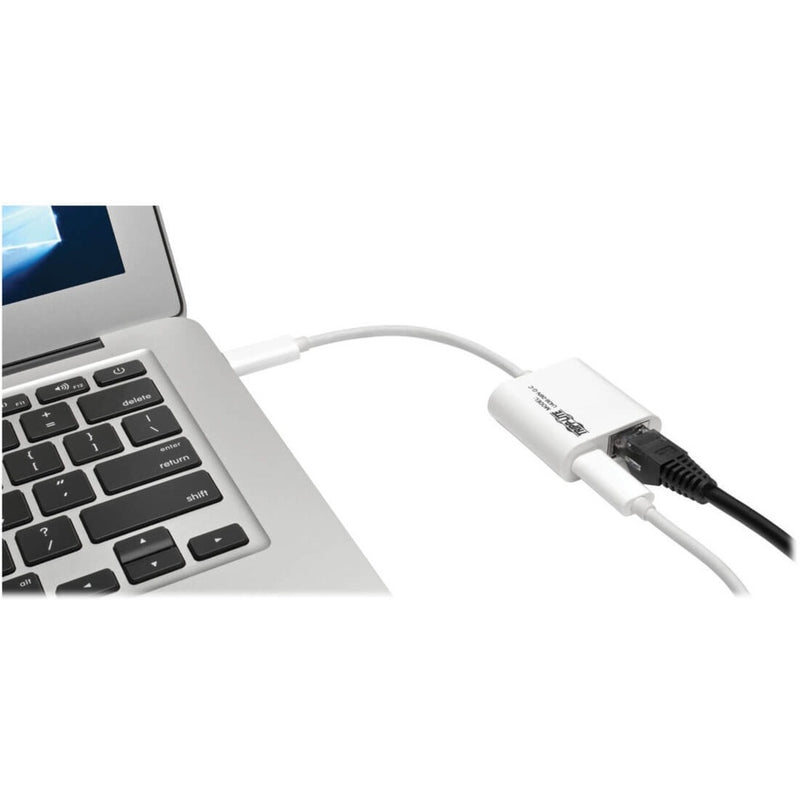 Tripp Lite adapter connected to laptop showing real-world usage