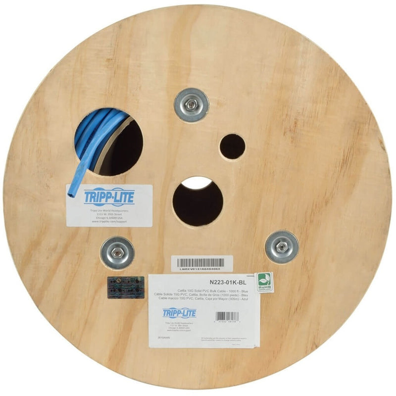 Close-up of wooden spool end showing product labels and certification information