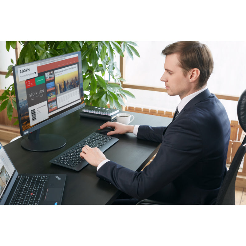 Professional workspace setup with Lenovo wireless keyboard and mouse combo