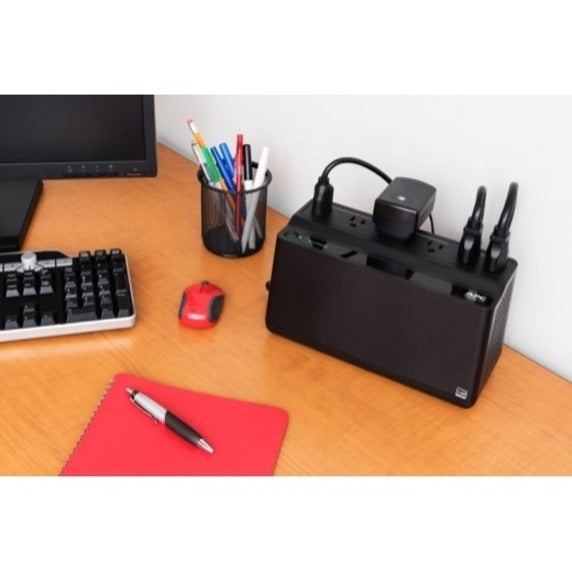 APC BE425M-LM Back-UPS in a desktop workspace environment with connected devices and office accessories