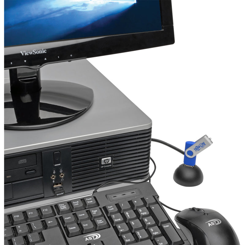 Desktop setup showing Tripp Lite USB extension hub connected to computer with keyboard and monitor