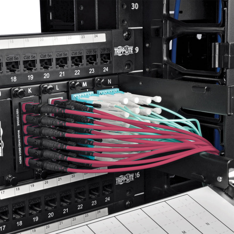 Multiple magenta MTP/MPO cables neatly arranged in a server rack showing organized cable management