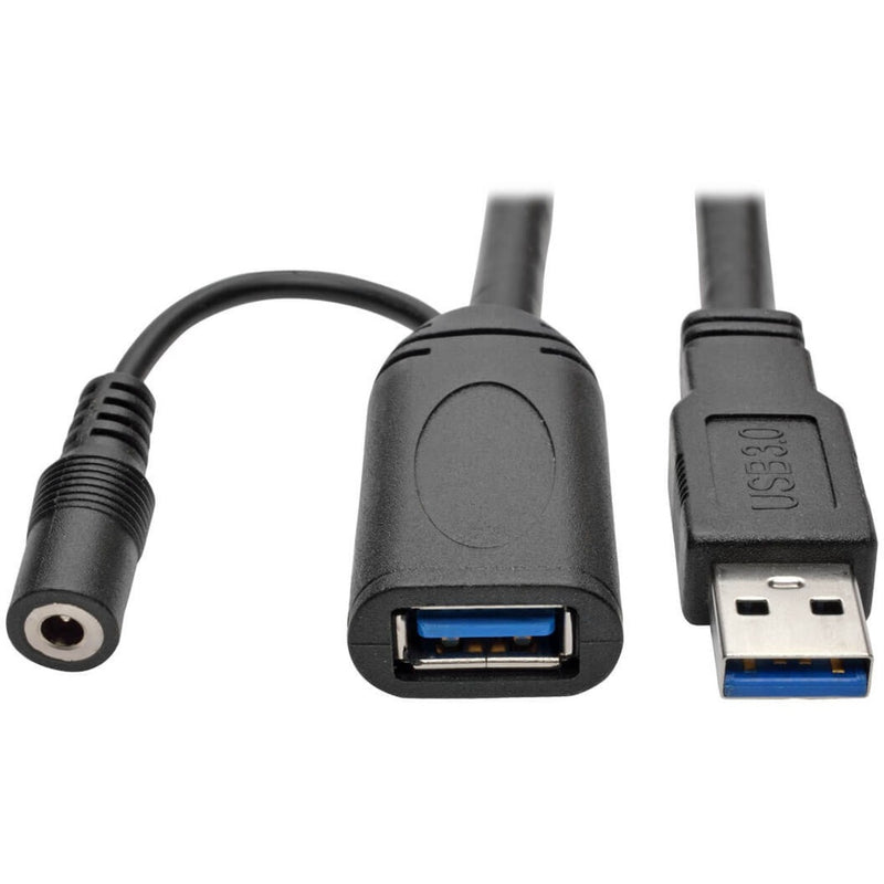 Close-up view of USB 3.0 connectors and power adapter port on Tripp Lite U330-20M active extension cable