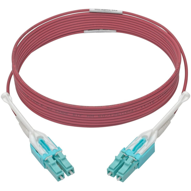 Full length view of magenta OM4 fiber cable with LC connectors on both ends