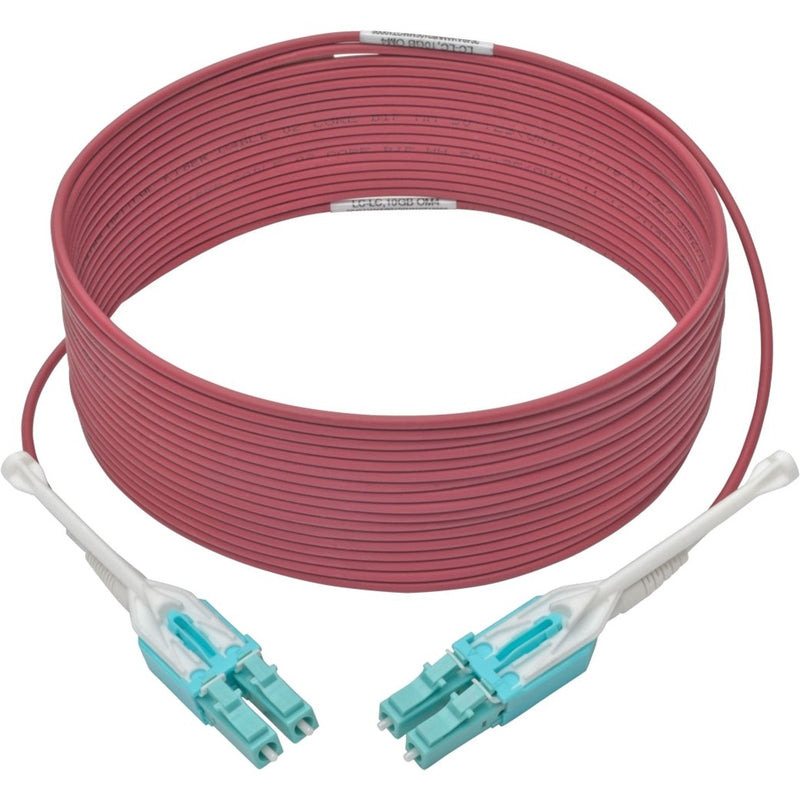 Full length view of magenta OM4 fiber optic cable with LC connectors