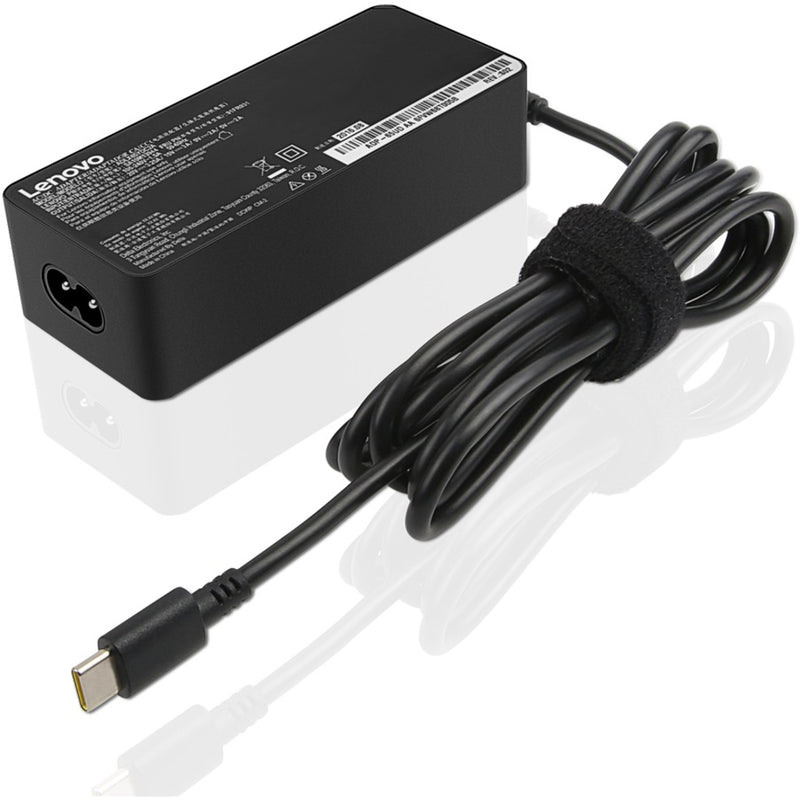 Detailed view of Lenovo 65W AC adapter showing safety certifications and specifications