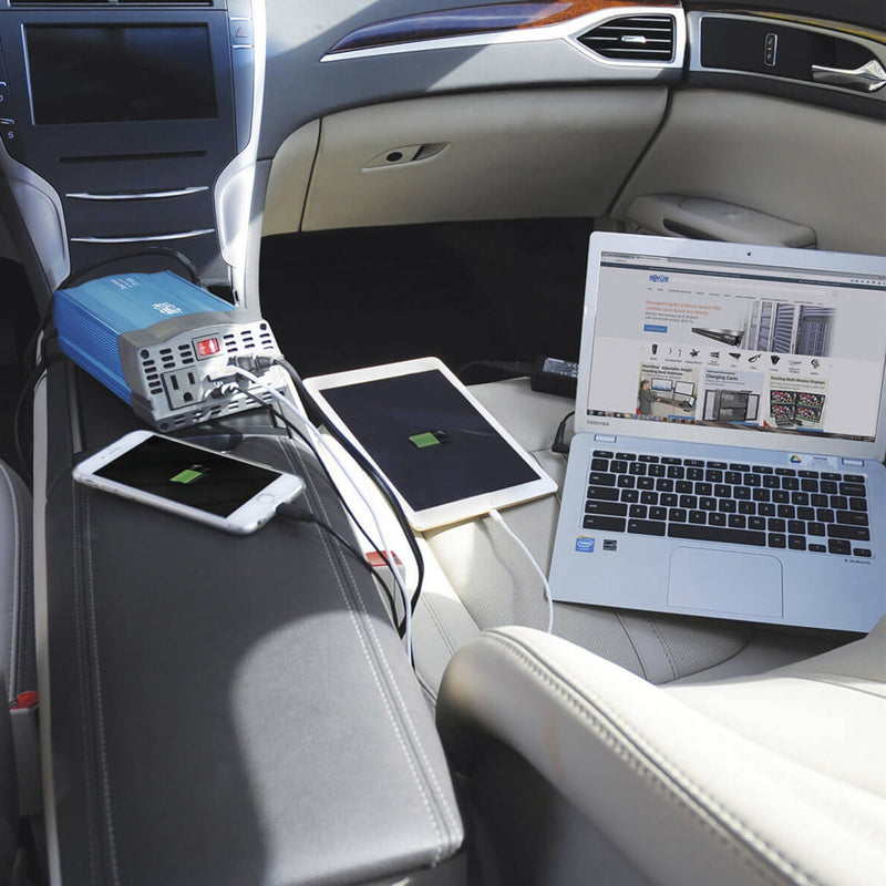 PV375USB inverter powering multiple devices in car interior including laptop and tablets