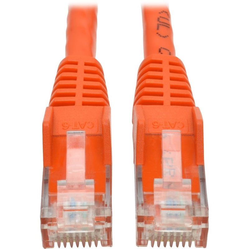 Close-up view of gold-plated RJ45 connectors on orange Cat6 ethernet cable showing transparent housing and pin configuration