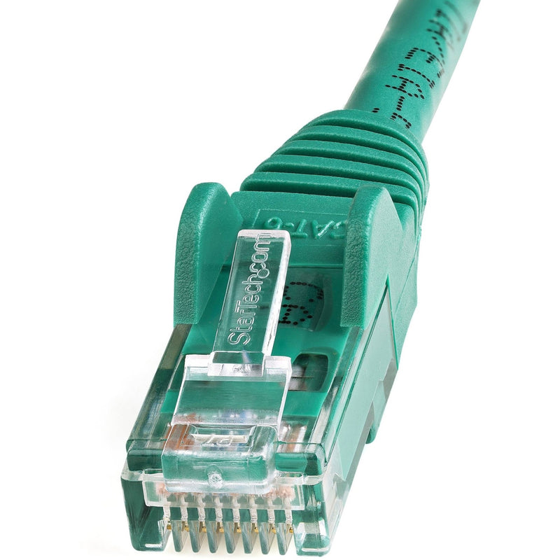 Detailed view of green ethernet cable connector showing molded strain relief and snagless design