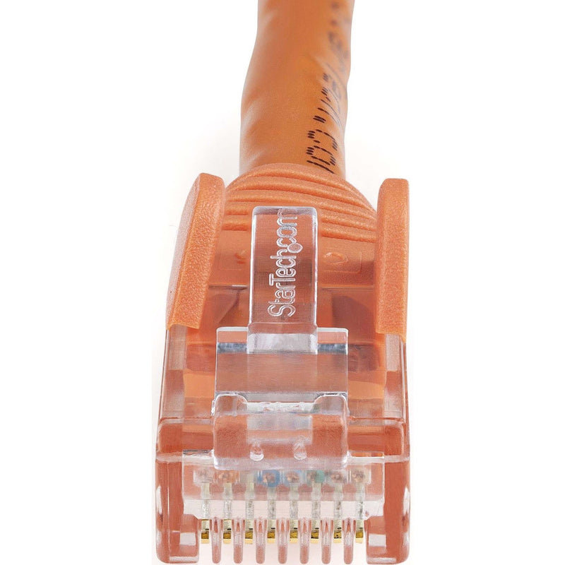 Detailed macro shot of orange Cat6 ethernet cable snagless connector boot and strain relief design