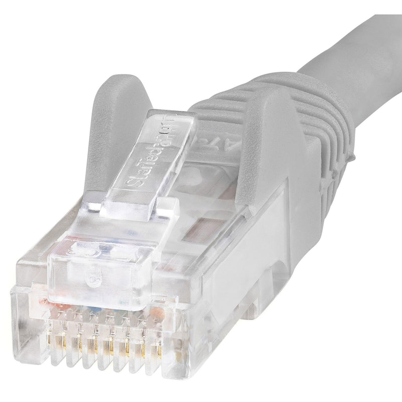 Macro shot of transparent RJ45 connector showing internal components and strain relief design