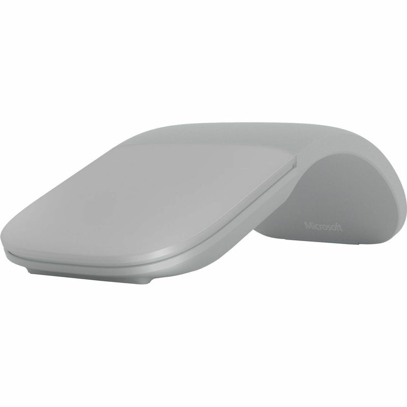 Microsoft Arc Touch Mouse in light gray showing curved ergonomic design from side view