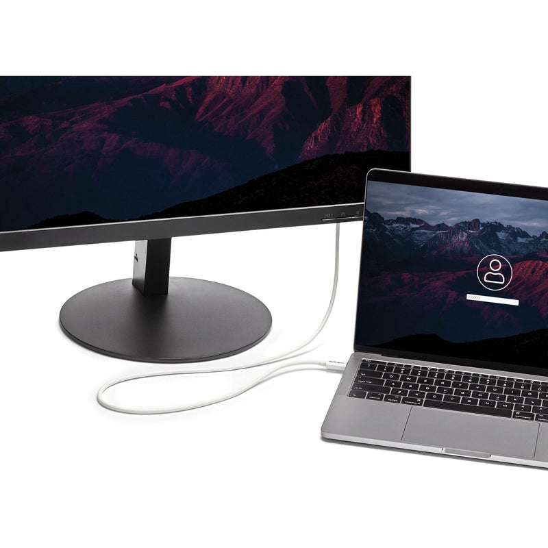 MacBook connected to external monitor using white Thunderbolt 3 cable