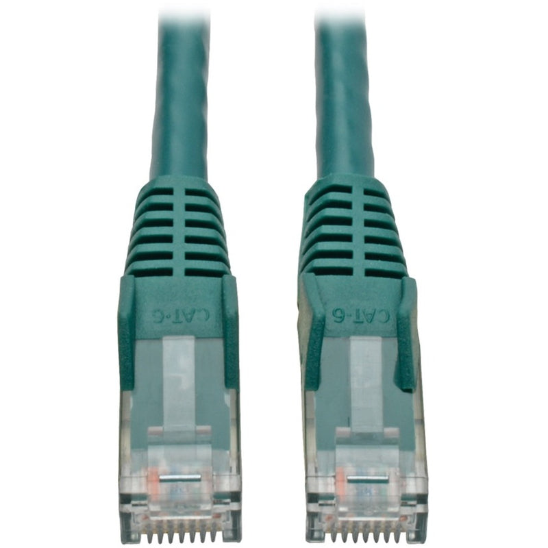 Close-up of gold-plated RJ45 connectors on green Cat6 ethernet cable showing transparent housing and contact pins