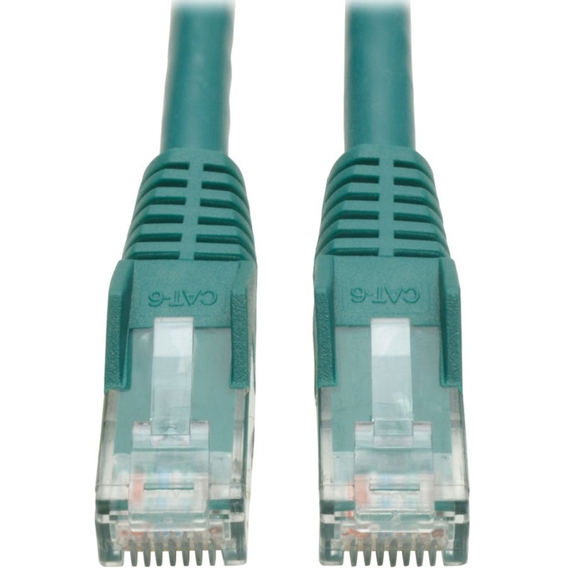 Close-up of green Cat6 cable RJ45 connectors showing gold-plated contacts and snagless boots