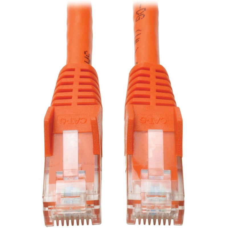 Close-up view of two orange Cat6 RJ45 connectors with gold-plated contacts and transparent housing