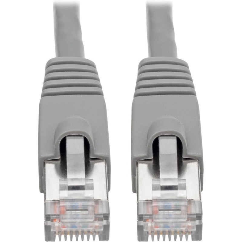 Close-up view of gray Cat6a cable ends showing snagless RJ45 connectors with strain relief boots