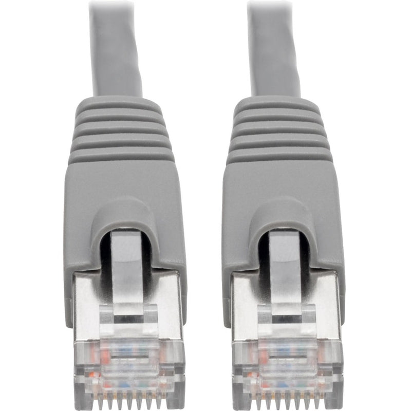 Close-up view of shielded RJ45 connectors on Cat6a network cable showing metallic shielding and strain relief