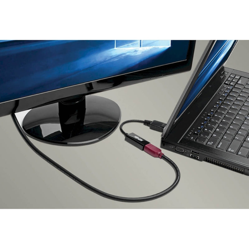 DisplayPort to HDMI adapter connected between laptop and monitor in office setting