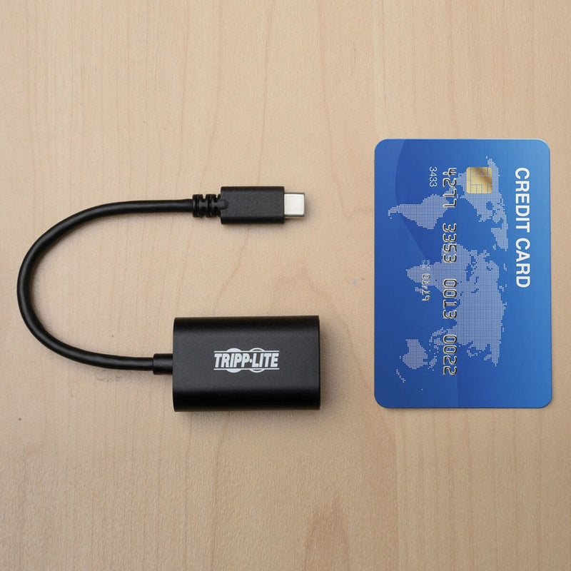 Adapter shown next to credit card for size comparison